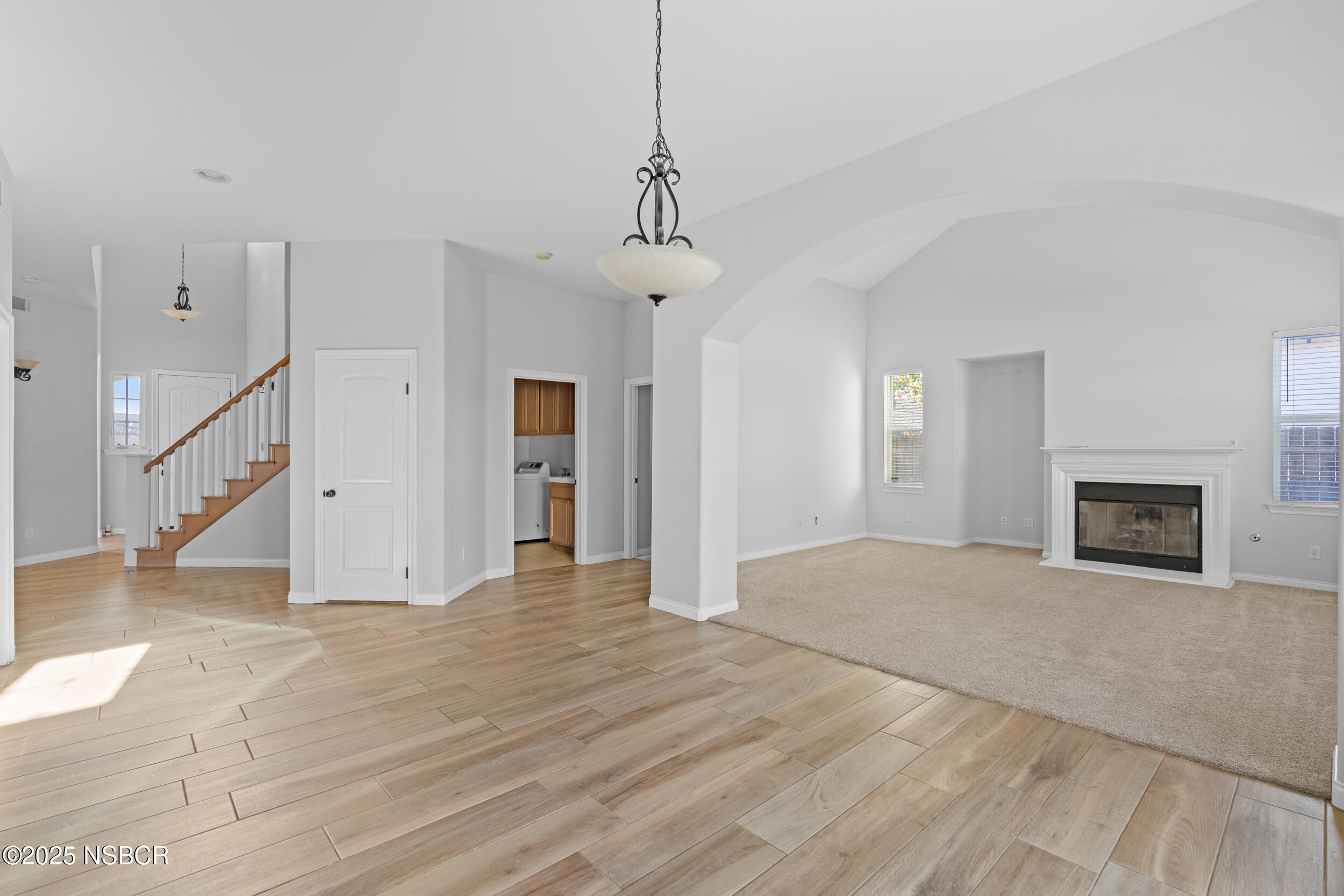 608 Celestial Way Lompoc, CA 93436 - Photo 7 of 40 a view of empty room with fireplace and wooden floor