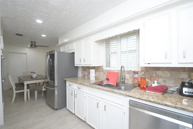 a view of storage and utility room with washer and dryer