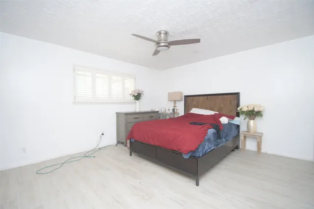 a spacious bathroom with a double vanity sink and a mirror