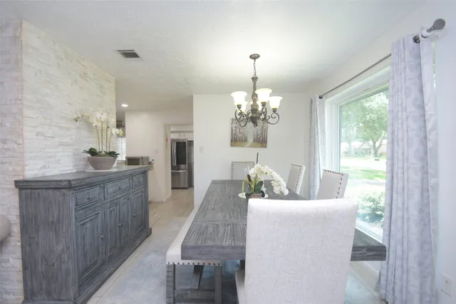 a bedroom with a bed and cabinet