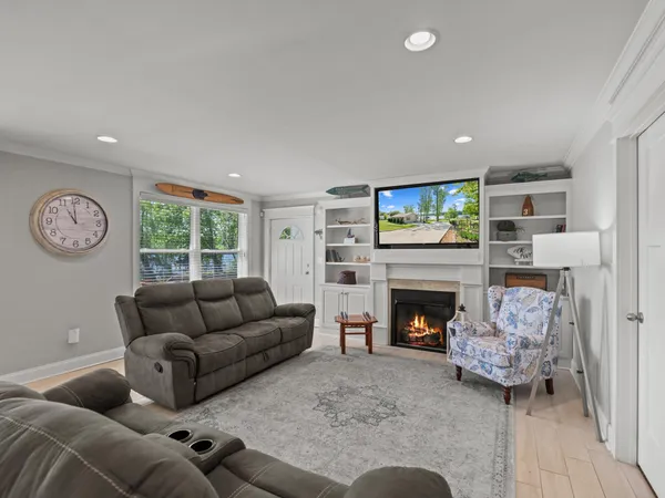 a living room with furniture and a fireplace