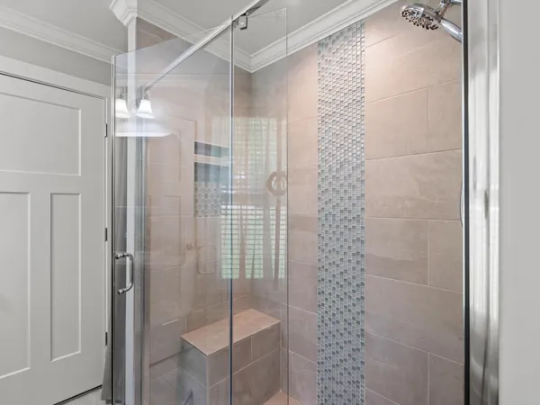 a bathroom with a shower and a sink