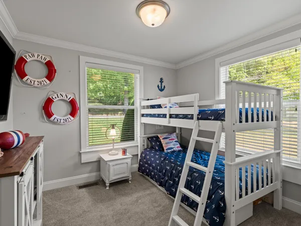 a bedroom with furniture and a window