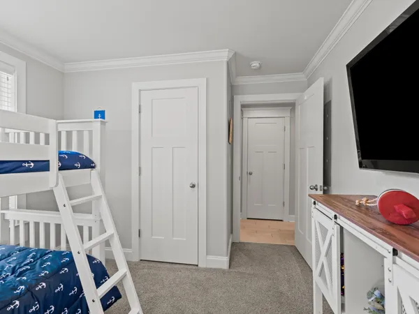 a view of an entryway with workspace and wooden floor