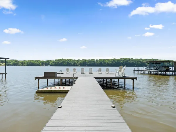 a view of house with outdoor seating and lake