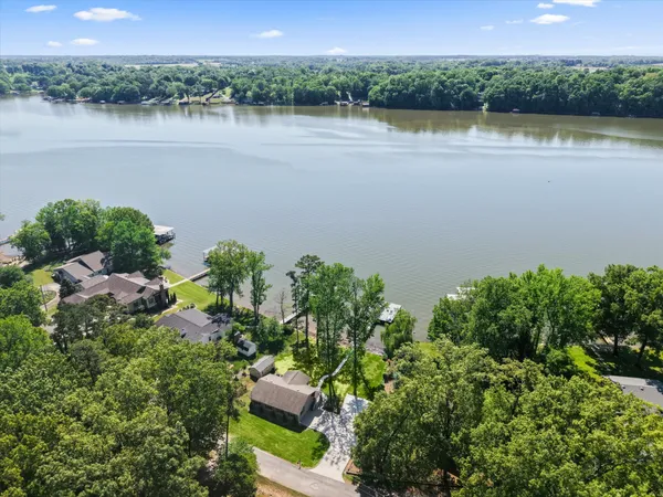 a view of a lake with a house in the background