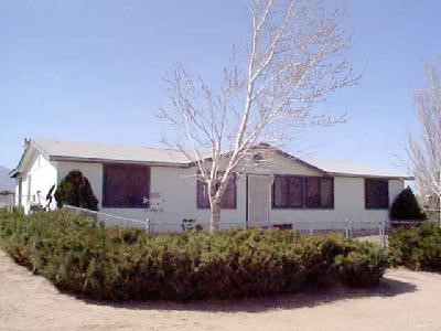 9480 Wilson Ranch Road Phelan, CA 92371 - Photo 1 of 1 a front view of a house with garden