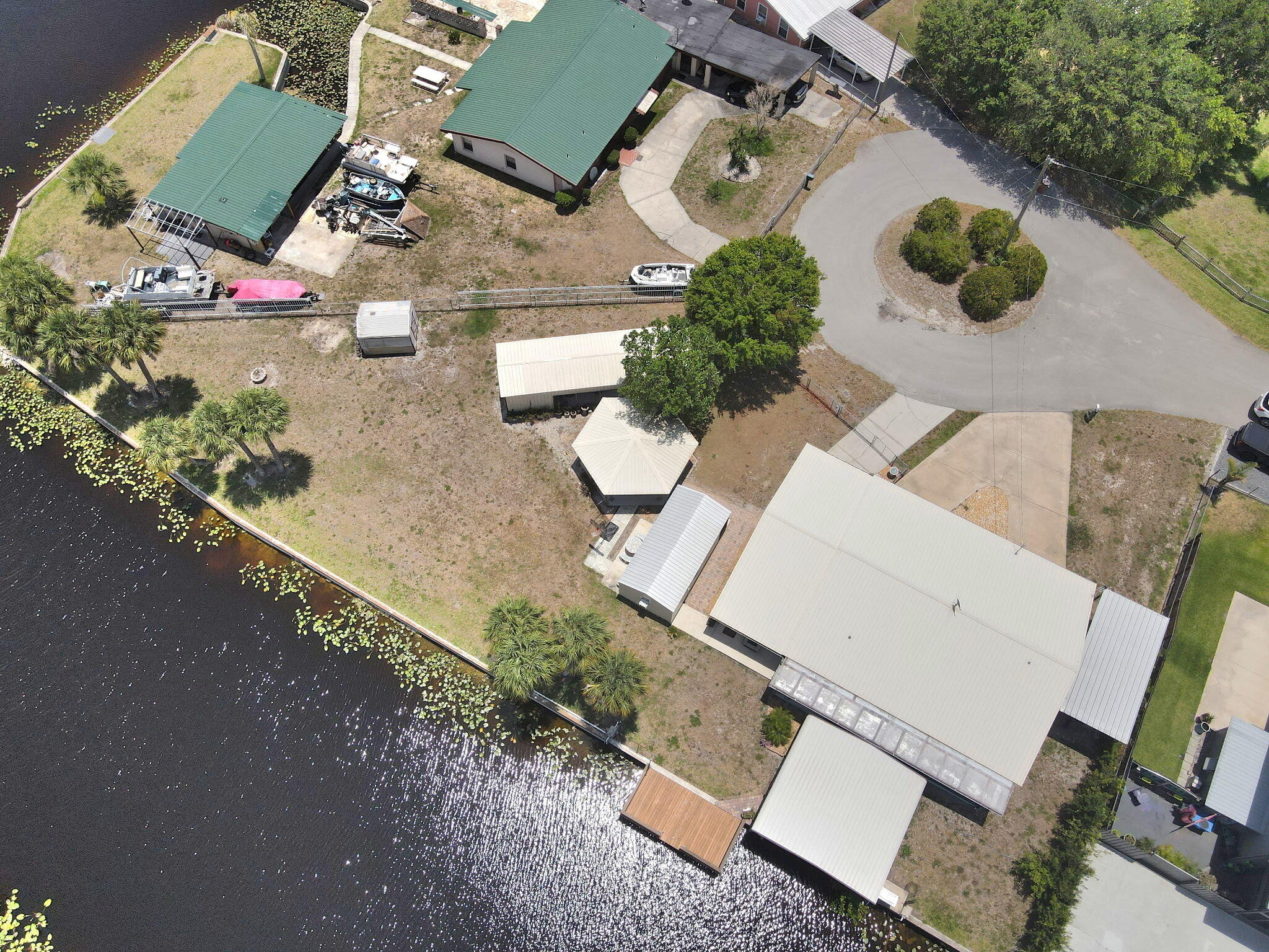1115 Elm Street Okeechobee, FL 34974 - Photo 5 of 37 an aerial view of a house with garden space and street view