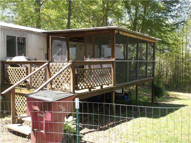 127 Sparrow Road Lafayette, TN 37083 - Photo 10 of 12 View of covered, screened in deck. This area is fenced for dogs.