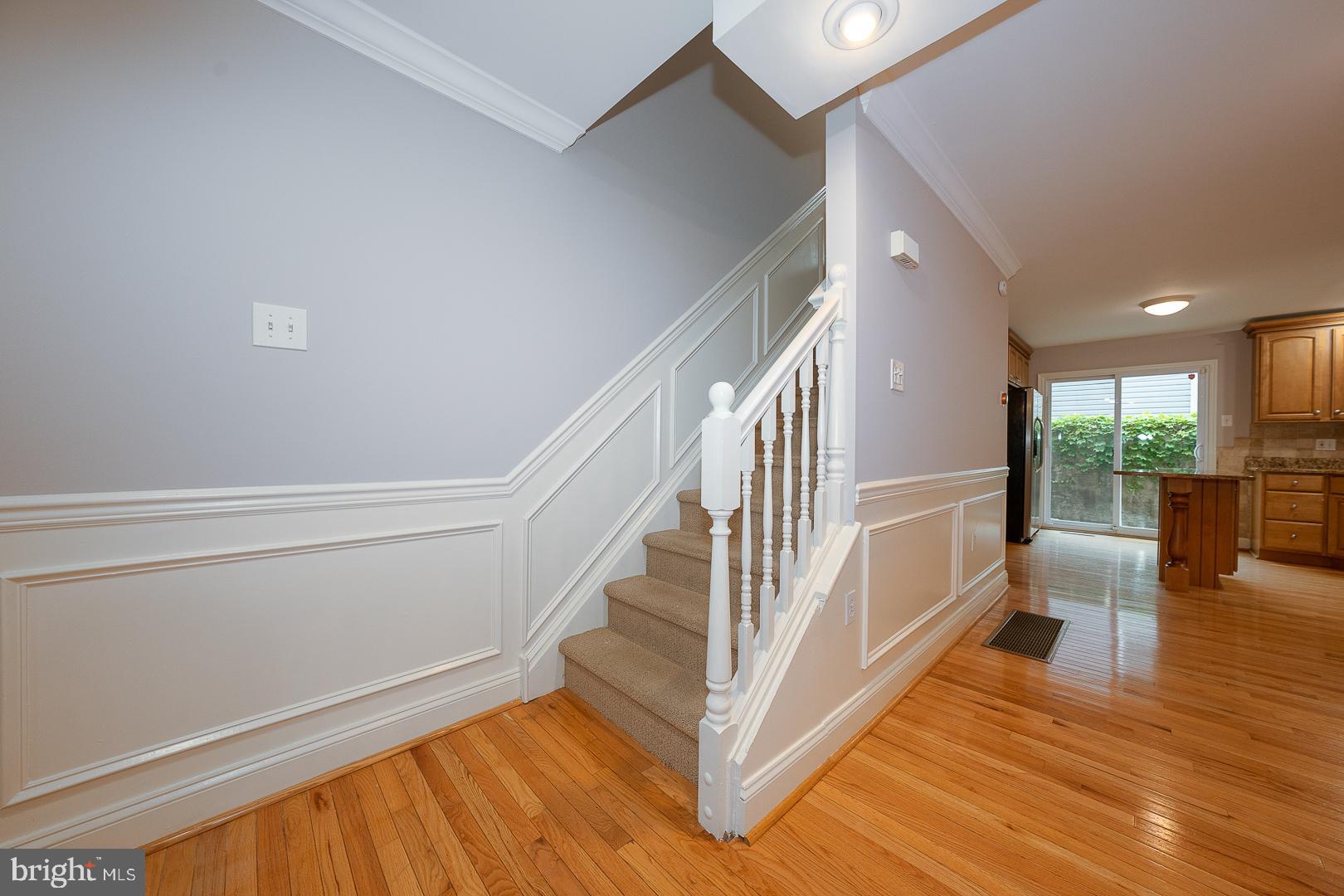 2406 Catharine Street Philadelphia, PA 19146 - Photo 11 of 37 a view of a hallway with wooden floor and staircase