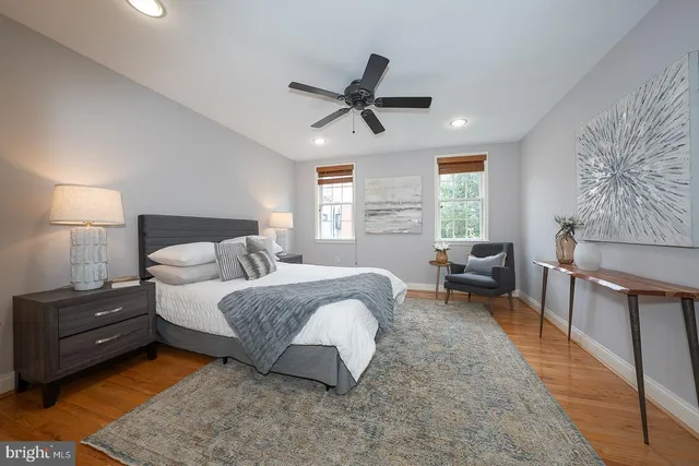 a bed room with a bed and a window