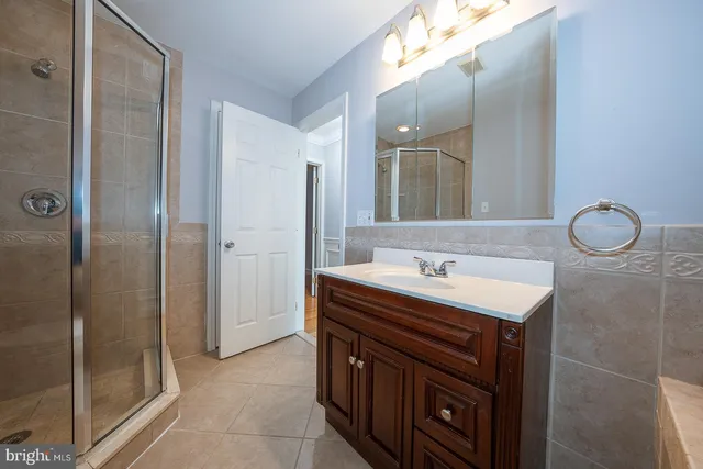 a bathroom with a sink a vanity and a mirror