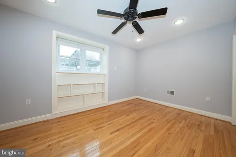 an empty room with a empty space and windows