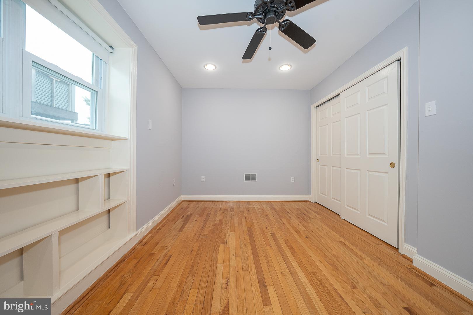 2406 Catharine Street Philadelphia, PA 19146 - Photo 23 of 37 a view of a room with wooden floor and white walls