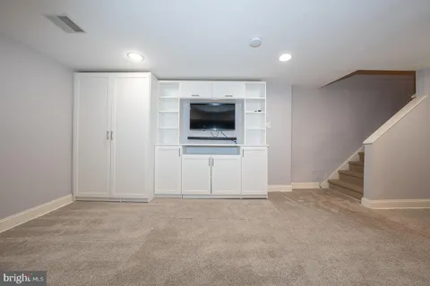 a view of a kitchen with a sink and a microwave