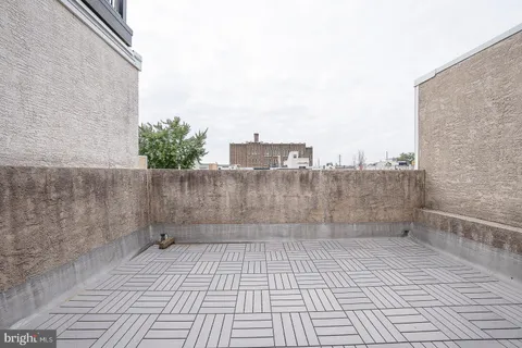 a front view of a house with a garden and garage