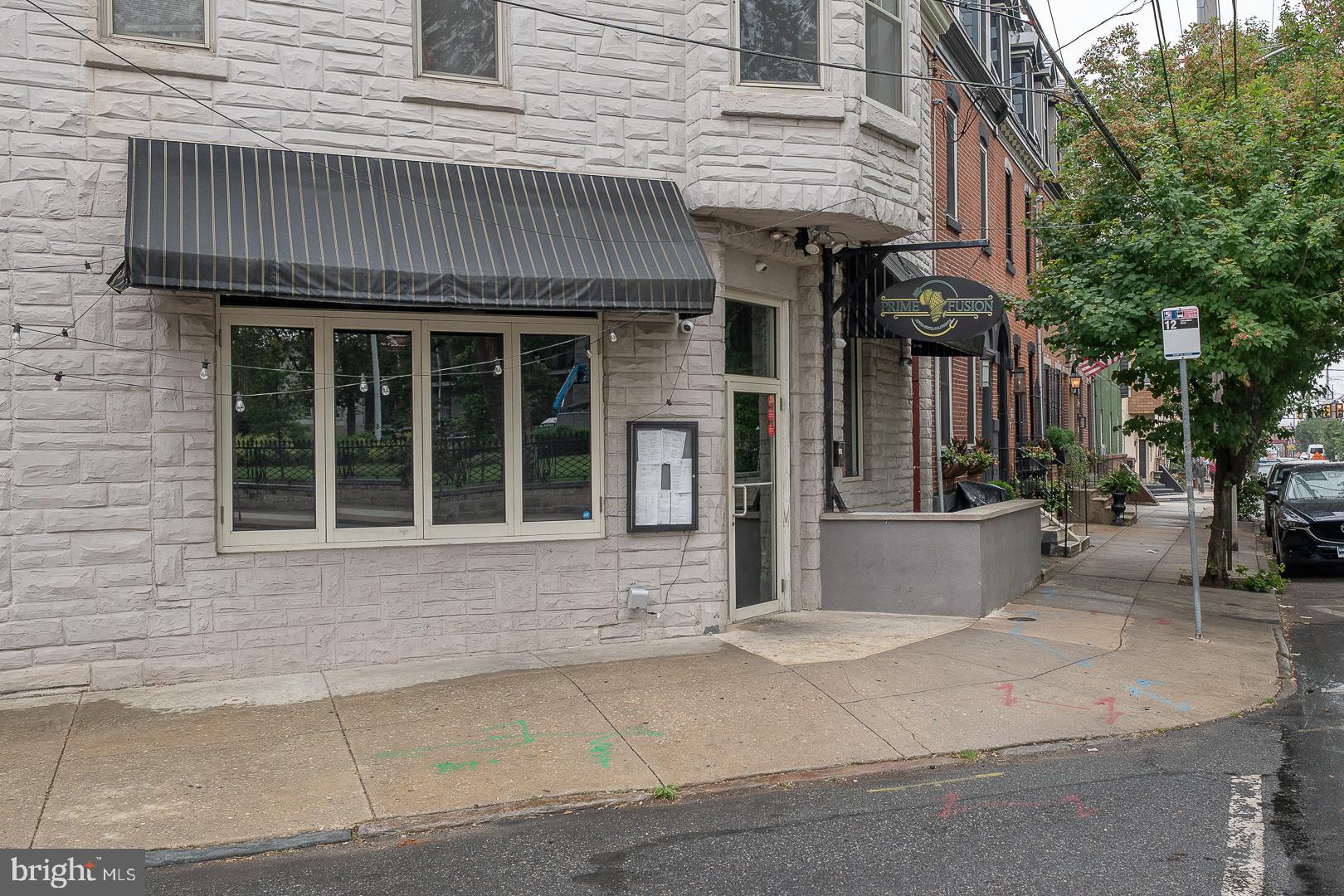 2406 Catharine Street Philadelphia, PA 19146 - Photo 34 of 37 a front view of a house with a garden and garage