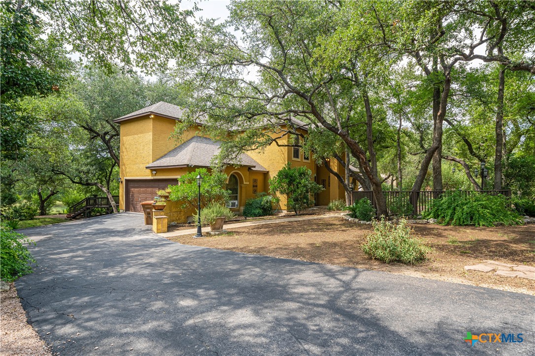 519 Long Meadow Spring Branch, TX 78070 - Photo 33 of 33 a backyard of a house with table and chairs