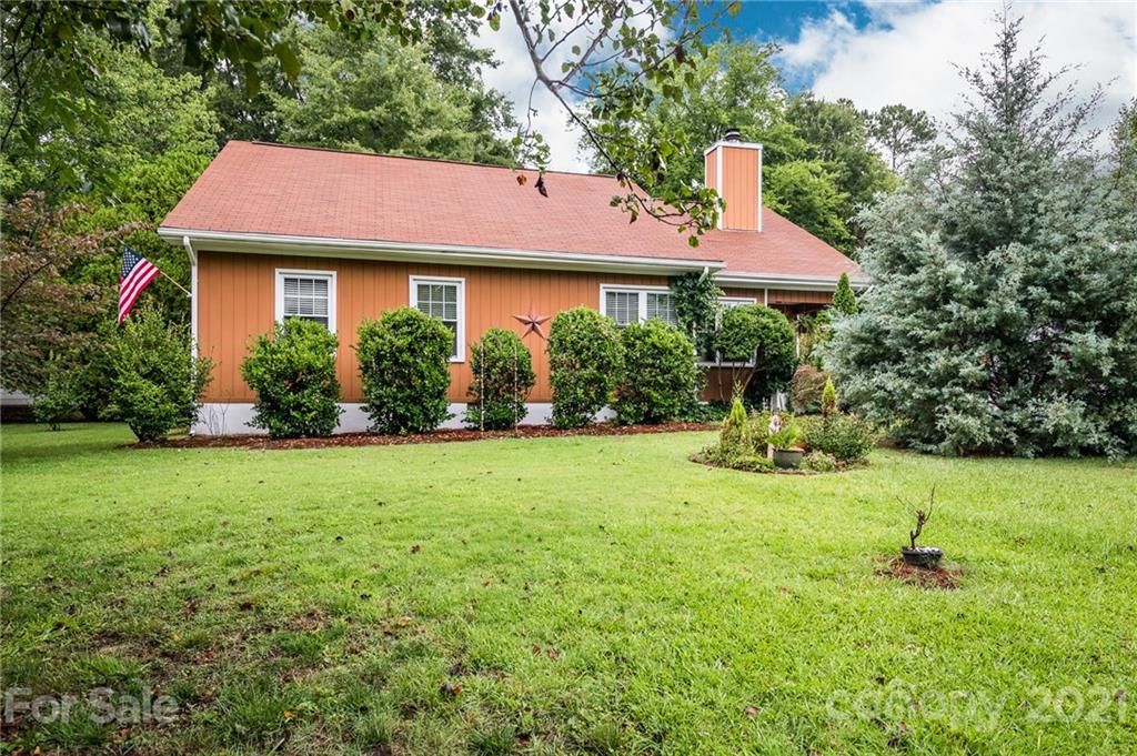 10900 Flat Iron Road Charlotte, NC 28226 - Photo 2 of 44 a front view of a house with a yard