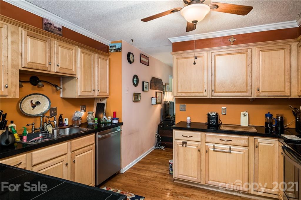 10900 Flat Iron Road Charlotte, NC 28226 - Photo 11 of 44 a kitchen with stainless steel appliances granite countertop a sink a stove and cabinets