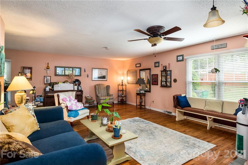 10900 Flat Iron Road Charlotte, NC 28226 - Photo 13 of 44 a living room with furniture and a large window