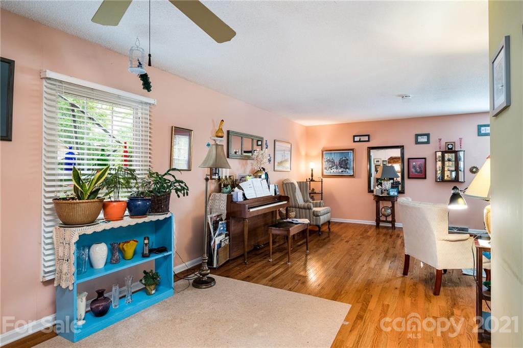 10900 Flat Iron Road Charlotte, NC 28226 - Photo 16 of 44 a living room with furniture and a window