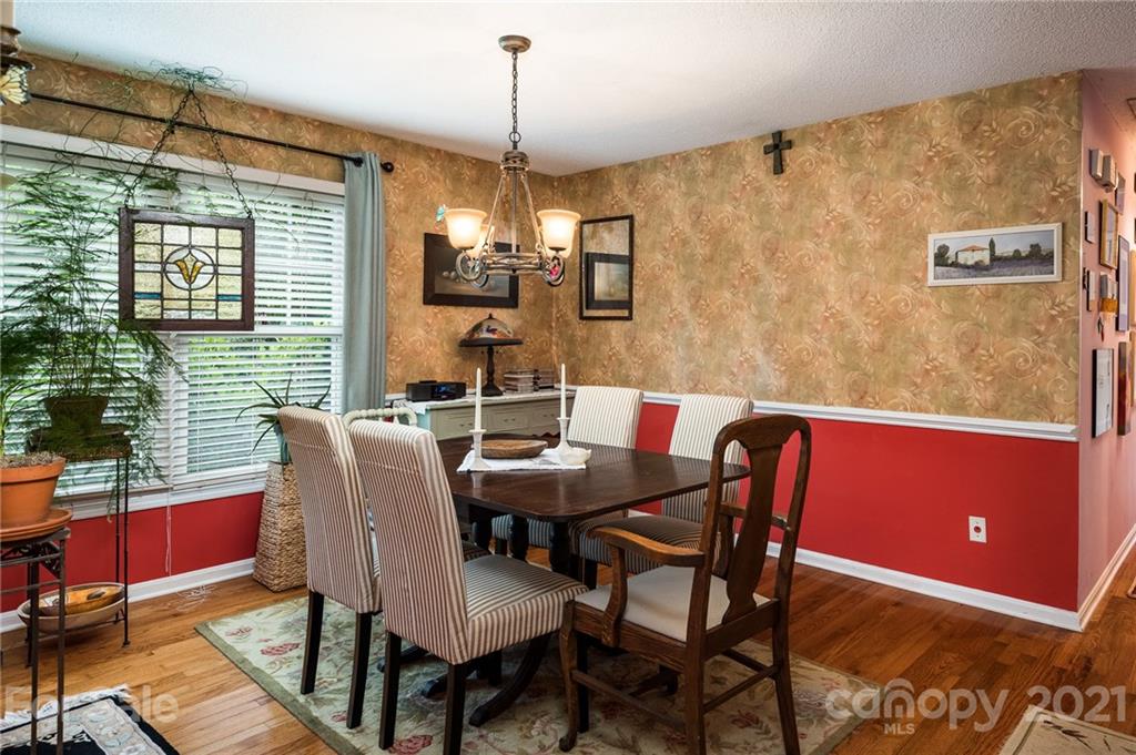 10900 Flat Iron Road Charlotte, NC 28226 - Photo 19 of 44 a view of a dining room with furniture window and outside view