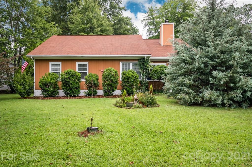10900 Flat Iron Road Charlotte, NC 28226 - Photo 3 of 44 a view of a house with backyard and garden