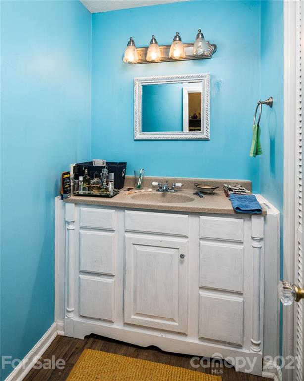 10900 Flat Iron Road Charlotte, NC 28226 - Photo 27 of 44 a bathroom with a sink and a mirror