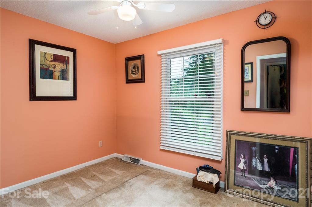 10900 Flat Iron Road Charlotte, NC 28226 - Photo 30 of 44 a bedroom with a bed and a window