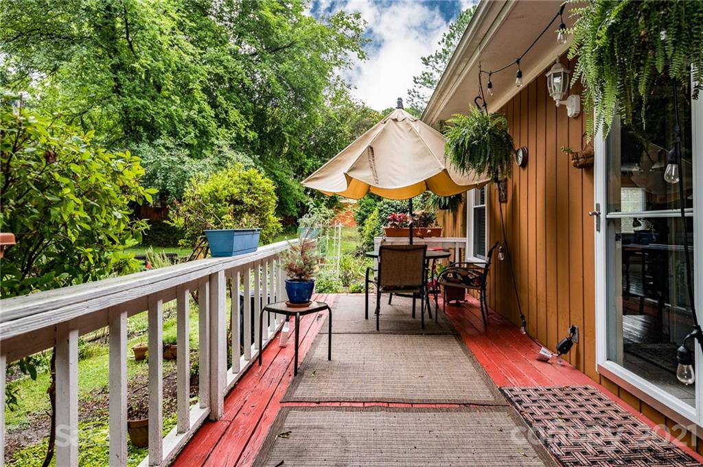 10900 Flat Iron Road Charlotte, NC 28226 - Photo 32 of 44 a view of a patio with table and chairs