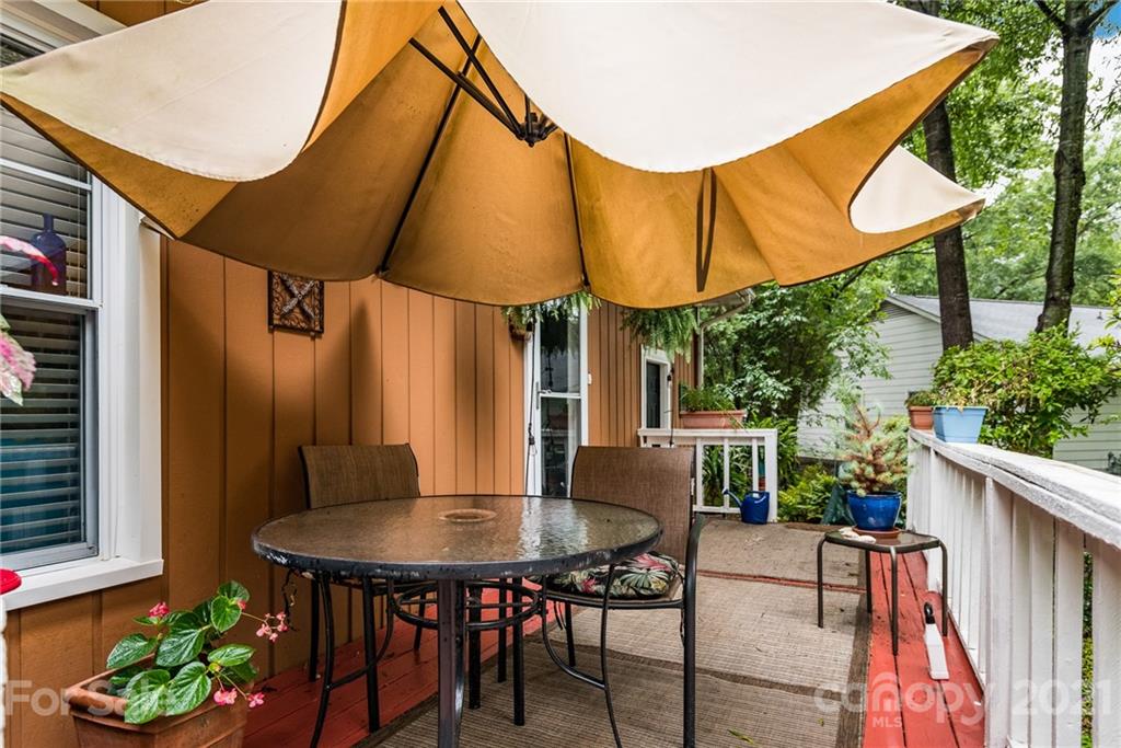 10900 Flat Iron Road Charlotte, NC 28226 - Photo 35 of 44 a view of balcony with table and chairs