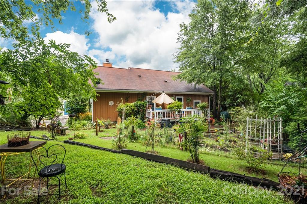 10900 Flat Iron Road Charlotte, NC 28226 - Photo 39 of 44 a view of house with a big yard and large trees