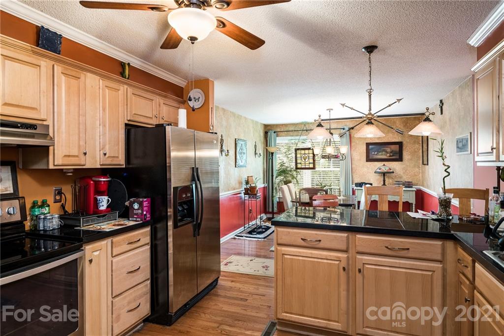 10900 Flat Iron Road Charlotte, NC 28226 - Photo 10 of 44 a kitchen with stainless steel appliances granite countertop a refrigerator a oven a sink and dishwasher