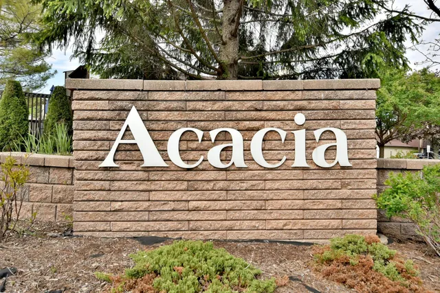 a view of outdoor space with a garden and signage