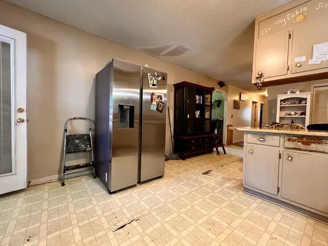 a bed room with a bed and a television