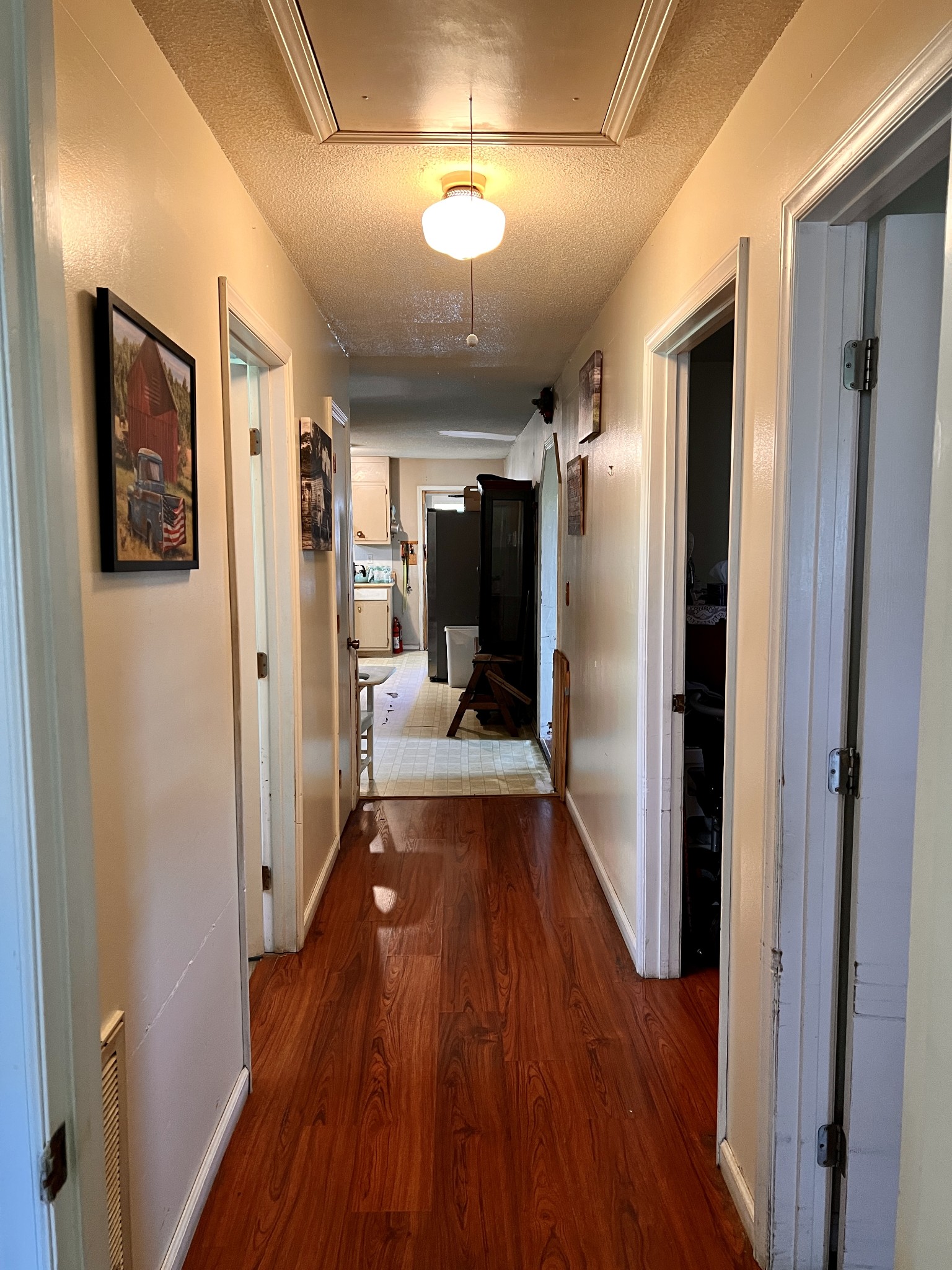 1112 Cumberland Street Decherd, TN 37324 - Photo 16 of 52 a view of a hallway with wooden floor and a bathroom