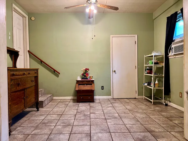 a view of a house with backyard and porch