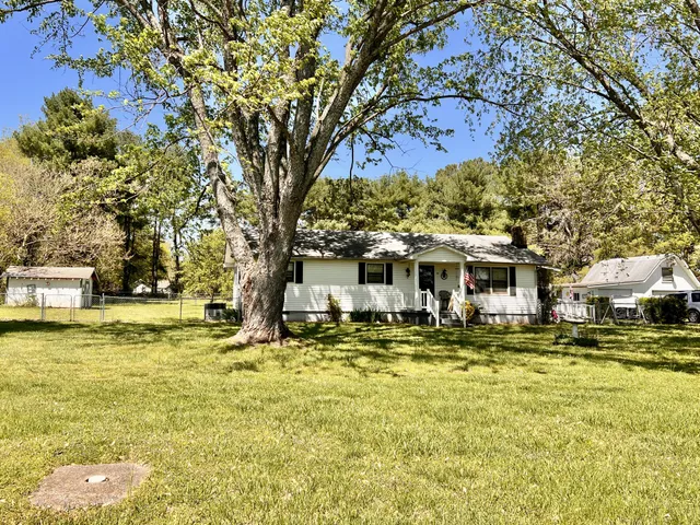 a front view of a building with swimming pool