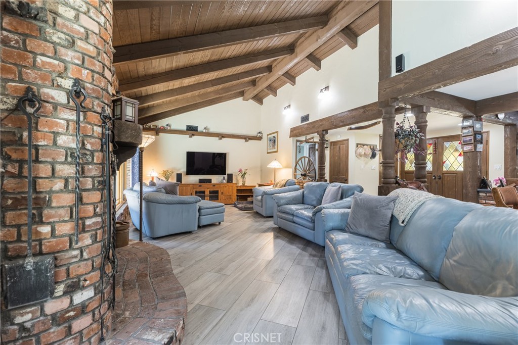 10610 Walnut Drive Shadow Hills, CA 91040 - Photo 12 of 50 a living room with furniture and a flat screen tv