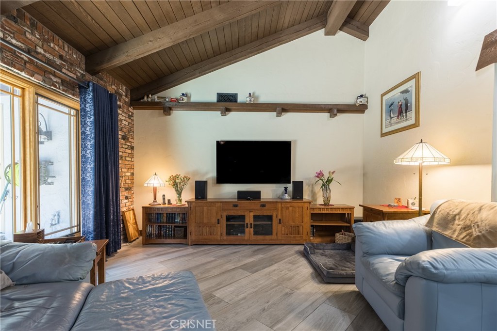 10610 Walnut Drive Shadow Hills, CA 91040 - Photo 15 of 50 a living room with furniture and a flat screen tv