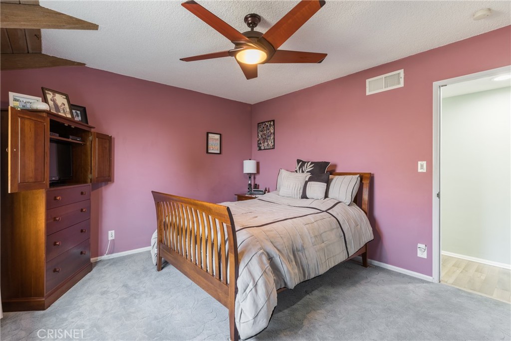 10610 Walnut Drive Shadow Hills, CA 91040 - Photo 24 of 50 a bedroom with a bed and a television
