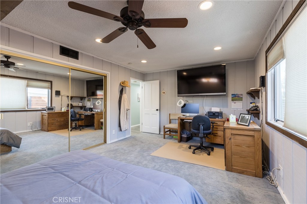 10610 Walnut Drive Shadow Hills, CA 91040 - Photo 27 of 50 a living room with furniture and a flat screen tv