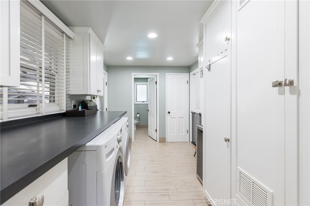 10610 Walnut Drive Shadow Hills, CA 91040 - Photo 32 of 50 a kitchen with a sink and refrigerator