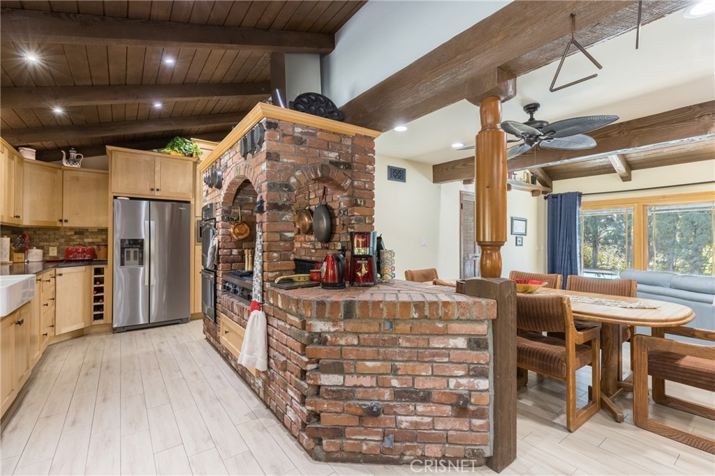10610 Walnut Drive Shadow Hills, CA 91040 - Photo 5 of 50 a view of a kitchen with furniture and a chandelier