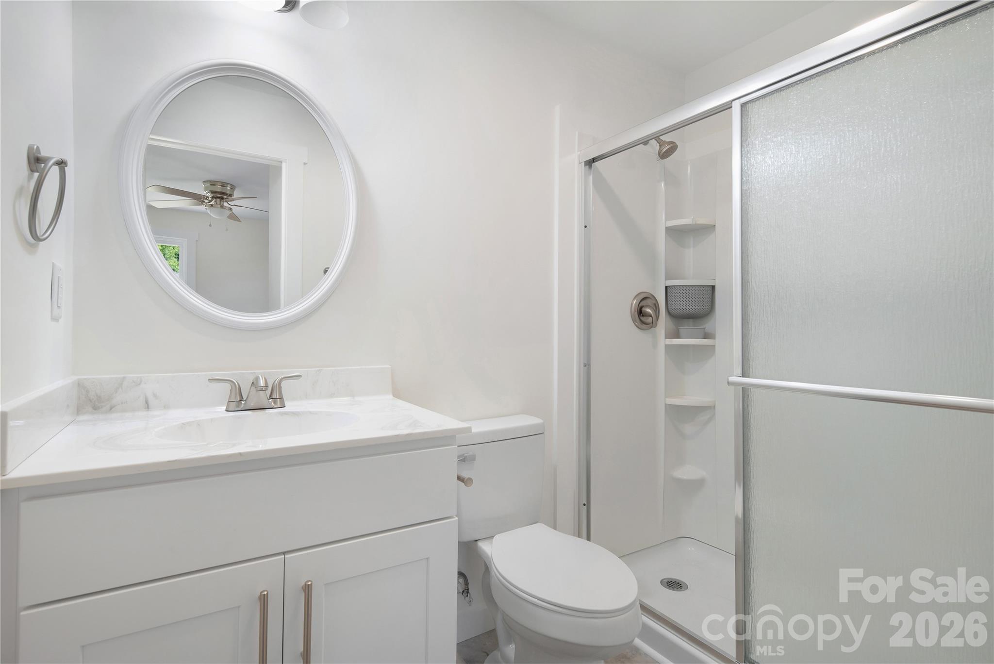 287 Duncan Road Flat Rock, NC 28731 - Photo 9 of 13 a bathroom with a toilet a sink and shower