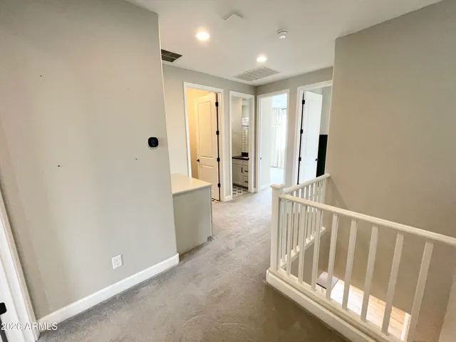 en empty room with window and a ceiling fan