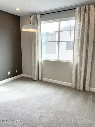 a bathroom with a sink a toilet a mirror and shower