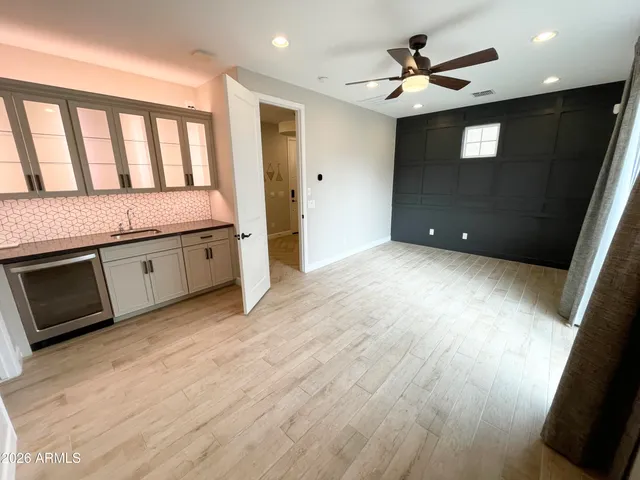 a view of a kitchen with a sink and a stove top oven