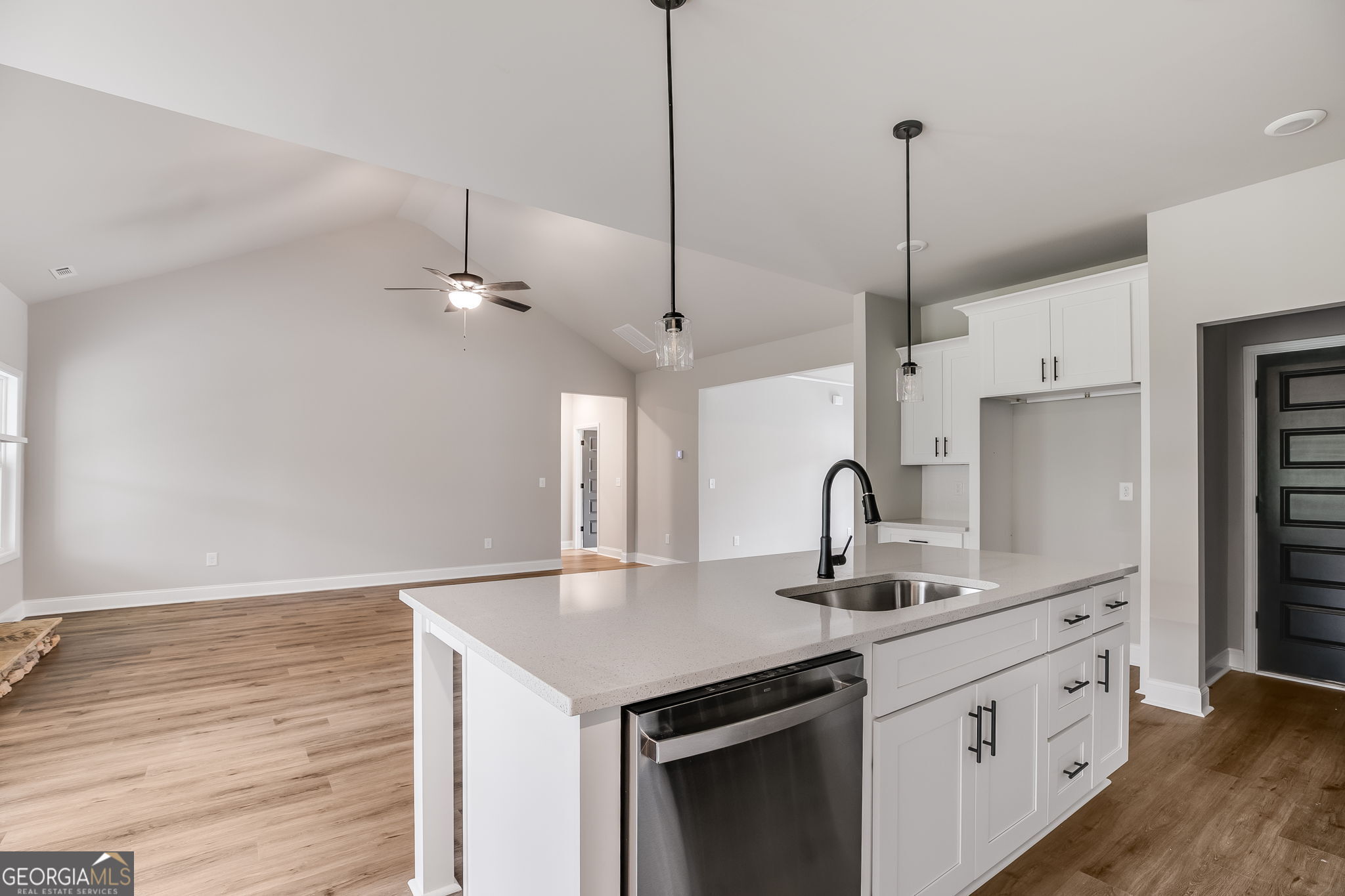 8970 Callaway Drive Winston, GA 30187 - Photo 12 of 24 a kitchen with kitchen island a counter space a sink appliances and cabinets